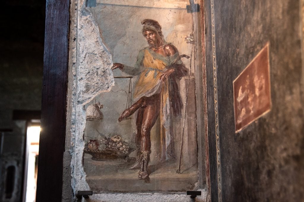 A fresco depicting God Priapus in the House of the Vettii in the Archaeological Park of Pompeii. Photo by Ivan Romano/Getty Images.