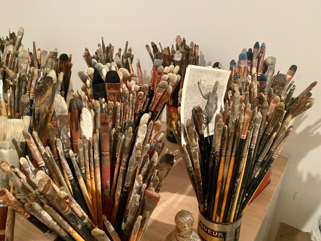 Y.Z. Kami saves all his old brushes in his Chelsea studio. Photo by Sarah Cascone. 