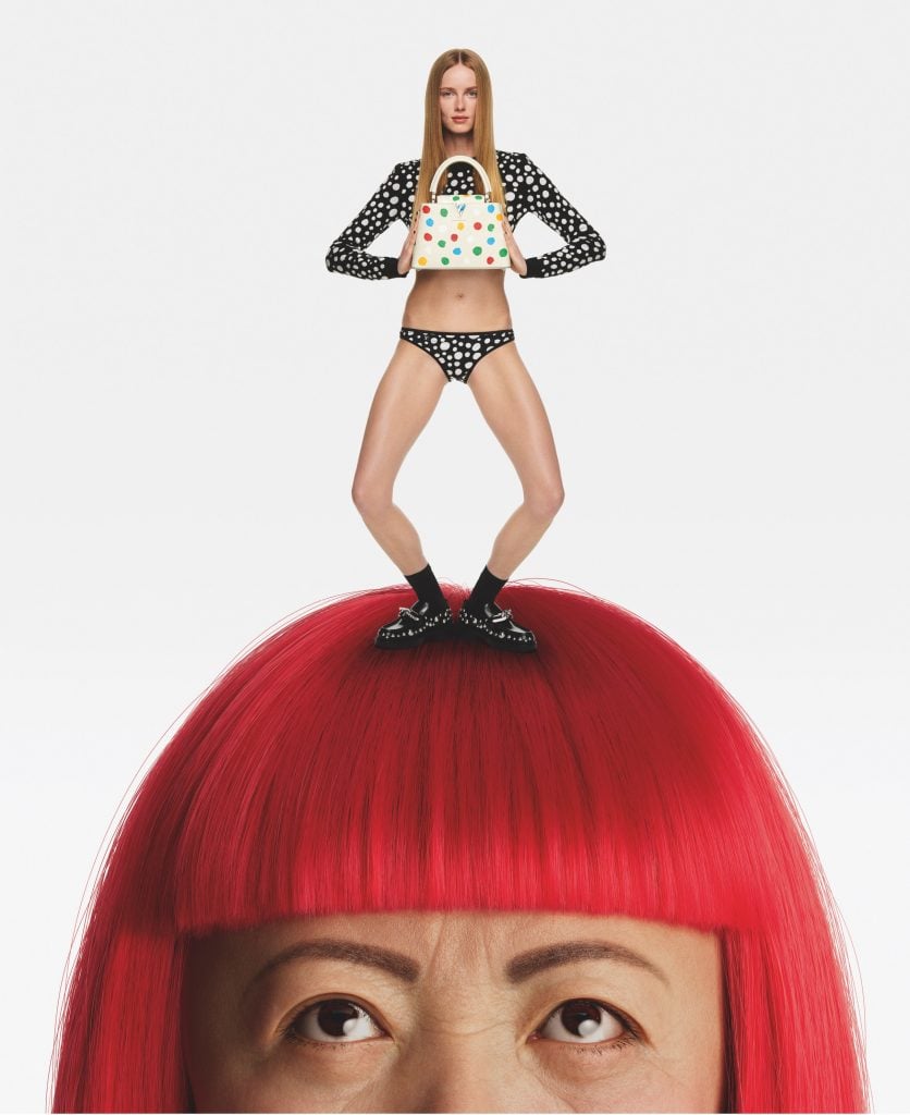 Standing upon genius: The model Riane Van Rompaey shows off the new bag atop Yayoi Kusama's signature wig. Courtesy of Louis Vuitton. 