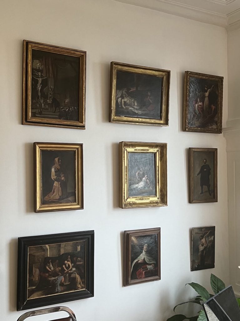 A wall including French 19th-Century paintings in Kientz's apartment. Image courtesy Guillame Kientz.