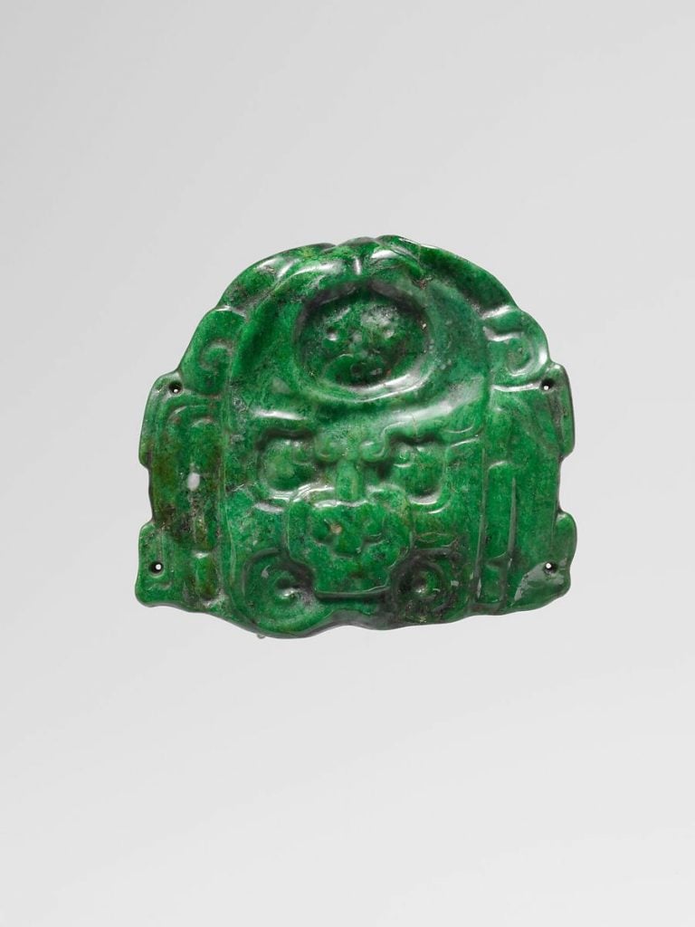 Jade deity face pendant (ca. 7th–9th century C.E.). Collection of the Metropolitan Museum of Art, New York. 