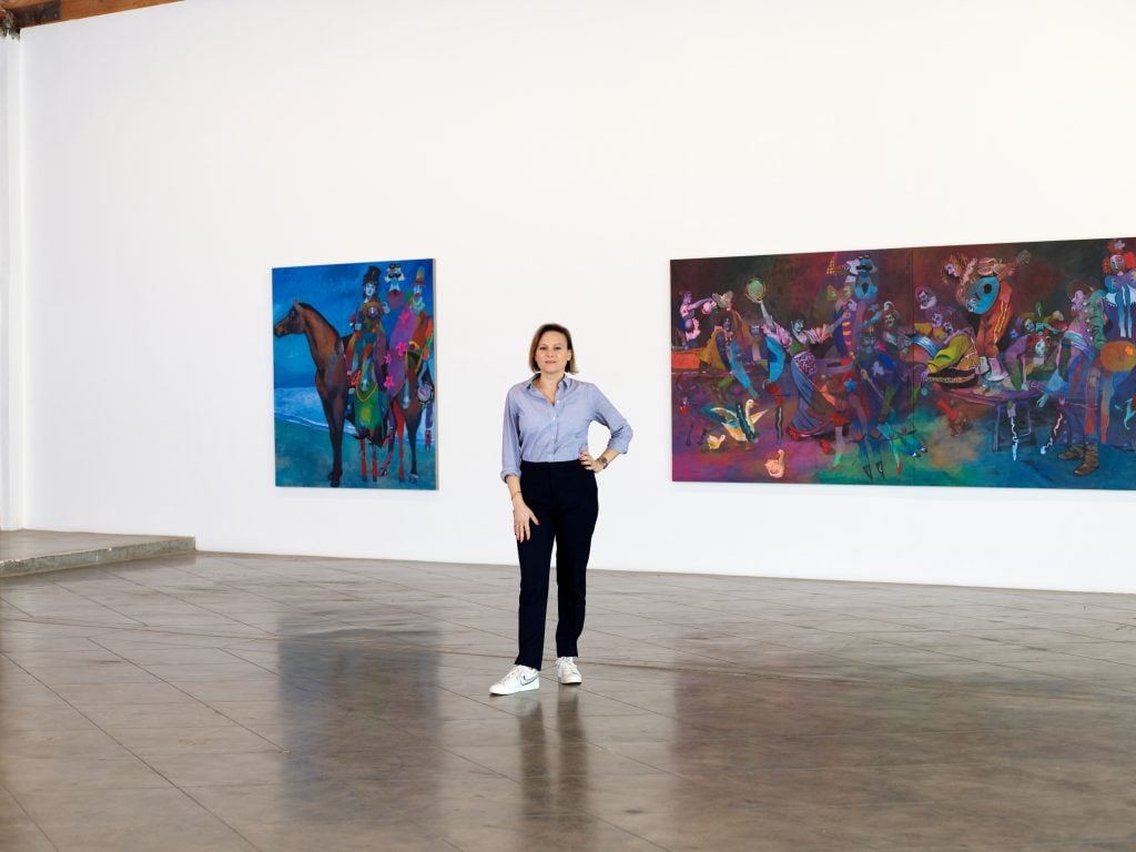 Los Angeles gallerist Anat Ebgi with works by Joshua Petker, currently on view at the Fountain Avenue location. Photo: Matthew Kroening. Courtesy of Anat Ebgi.