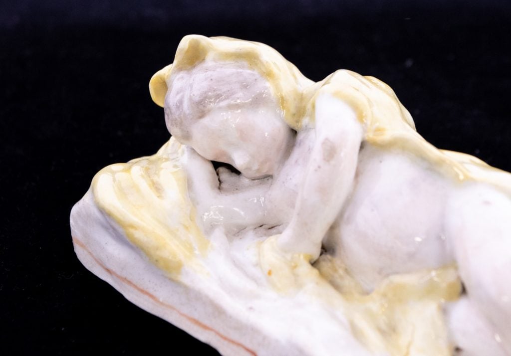 The sleeping baby porcelain figure. Photo: Hansons Auctioneers.