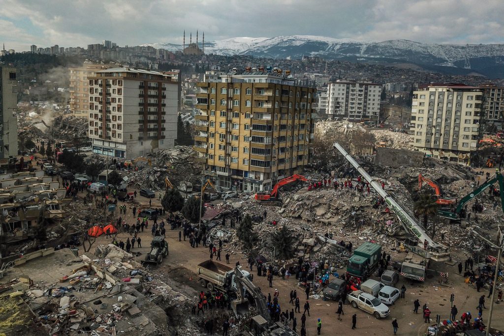 This aerial view shows collapsed buildings during the ongoing rescue operation in Kahramanmaras, the epicentre of the first 7.8-magnitude tremor five days ago, in southeastern Turkey, on February 10, 2023. Photo by Ozan Kose/AFP via Getty Images.