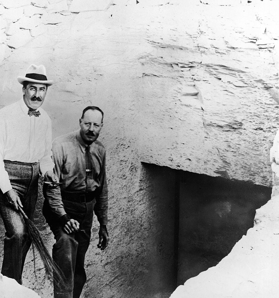 British Egyptologist Howard Carter (left) with his assistant Arthur Callender on the steps leading to the entrance to the tomb of Pharaoh Tutankhamen, Thebes, Egypt, 1922. Photo: Pictorial Parade/Getty Images.