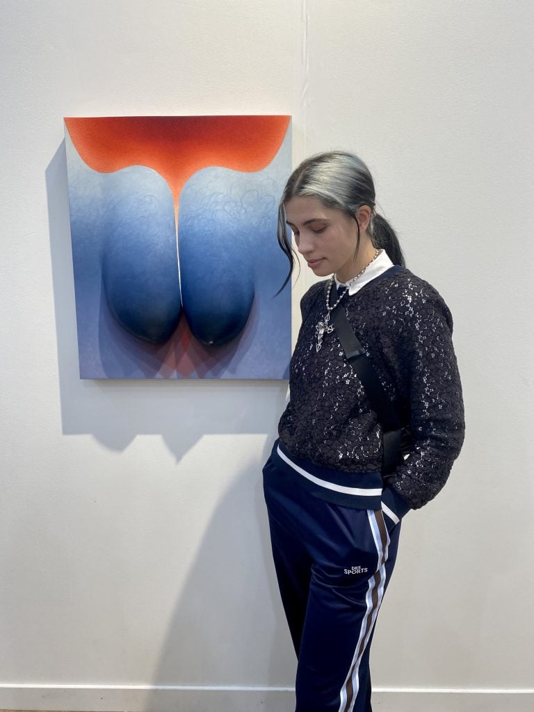 Nadya Tolokonnnikova with Loie Hollowell's <em>Heavy Burden, from San Francisco's Jessica Silverman Gallery at Frieze Los Angeles 2023. Photo by Sarah Cascone. 