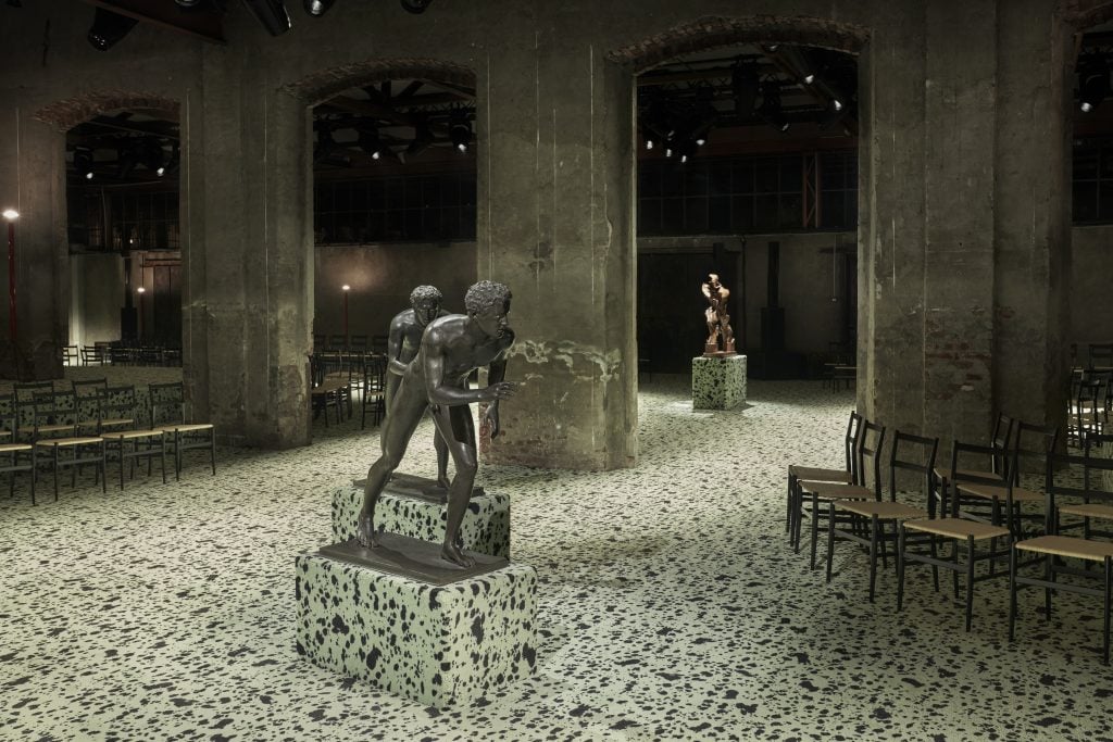An interior view of the Fall 2023 Bottega Veneta set. The 1st Centurt BC runners are in the foreground, Boccioni's Unique Forms of Continuity in Space can be in the back. Courtesy of Bottega Veneta. 