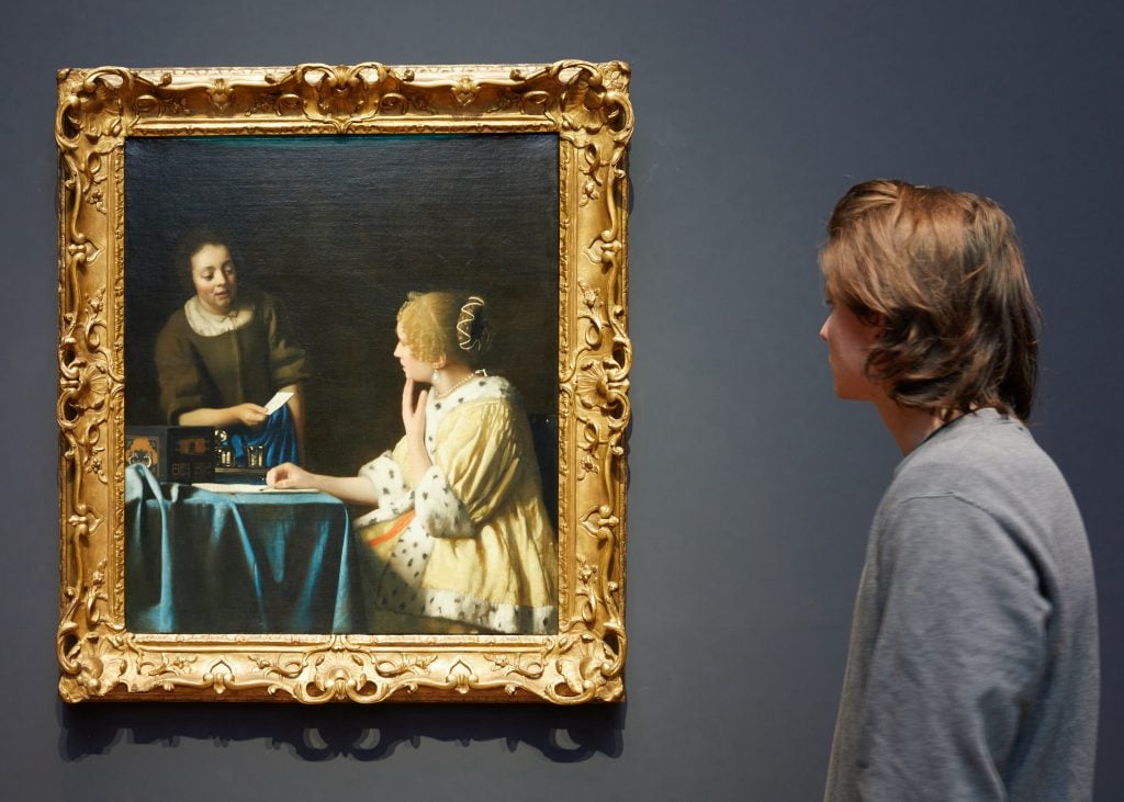 Installation view of <i>Mistress and Maid</i> at "Vermeer," Rijksmuseum. Work on loan from the Frick Collection, New York. Photo Rijksmuseum/ Henk Wildschut.