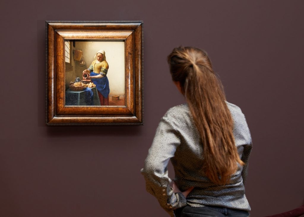 <i>The Milkmaid</i> featured in exhibition "Vermeer". Photo Rijksmuseum/ Henk Wildschut.