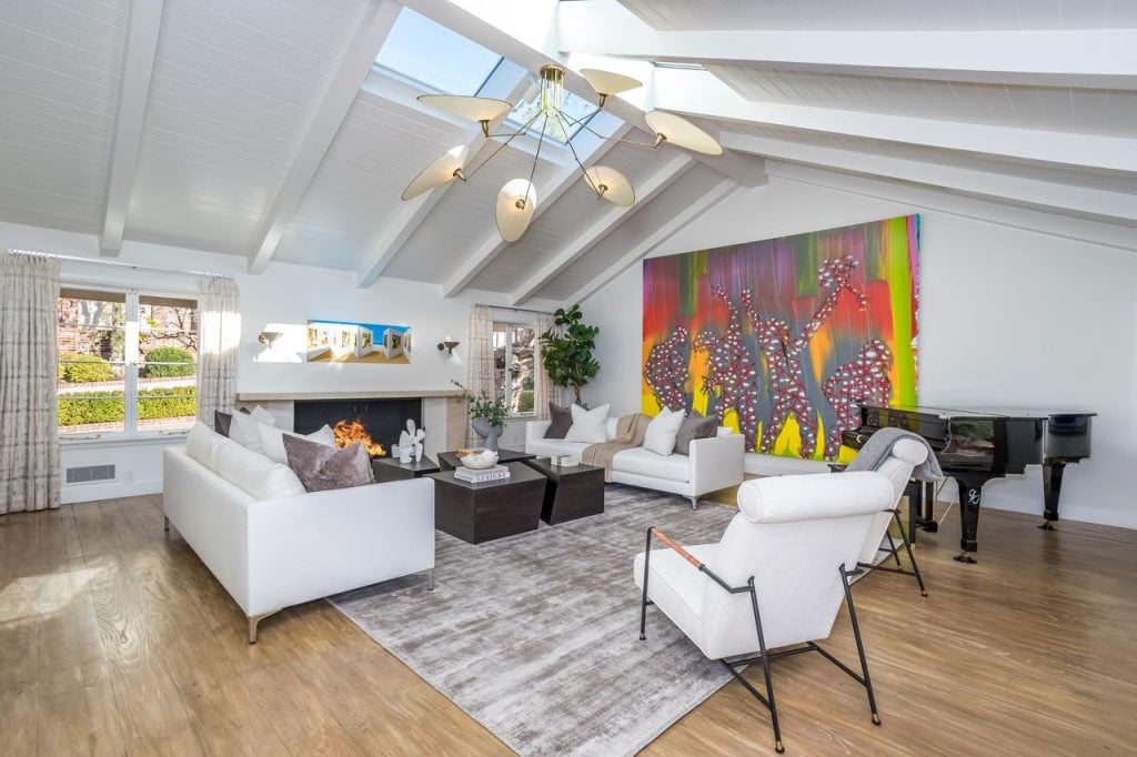 Details from Jim Carrey's Los Angeles home, now on the market for $28.9 million, with his painting <em>Hooray We Are All Broken</em> on the living room wall. Photo by Daniel Dahler, courtesy of Sotheby's International Realty.