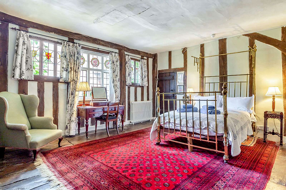 One of nine bedrooms in the Elizabethan estate. Courtesy of Savills Realty.