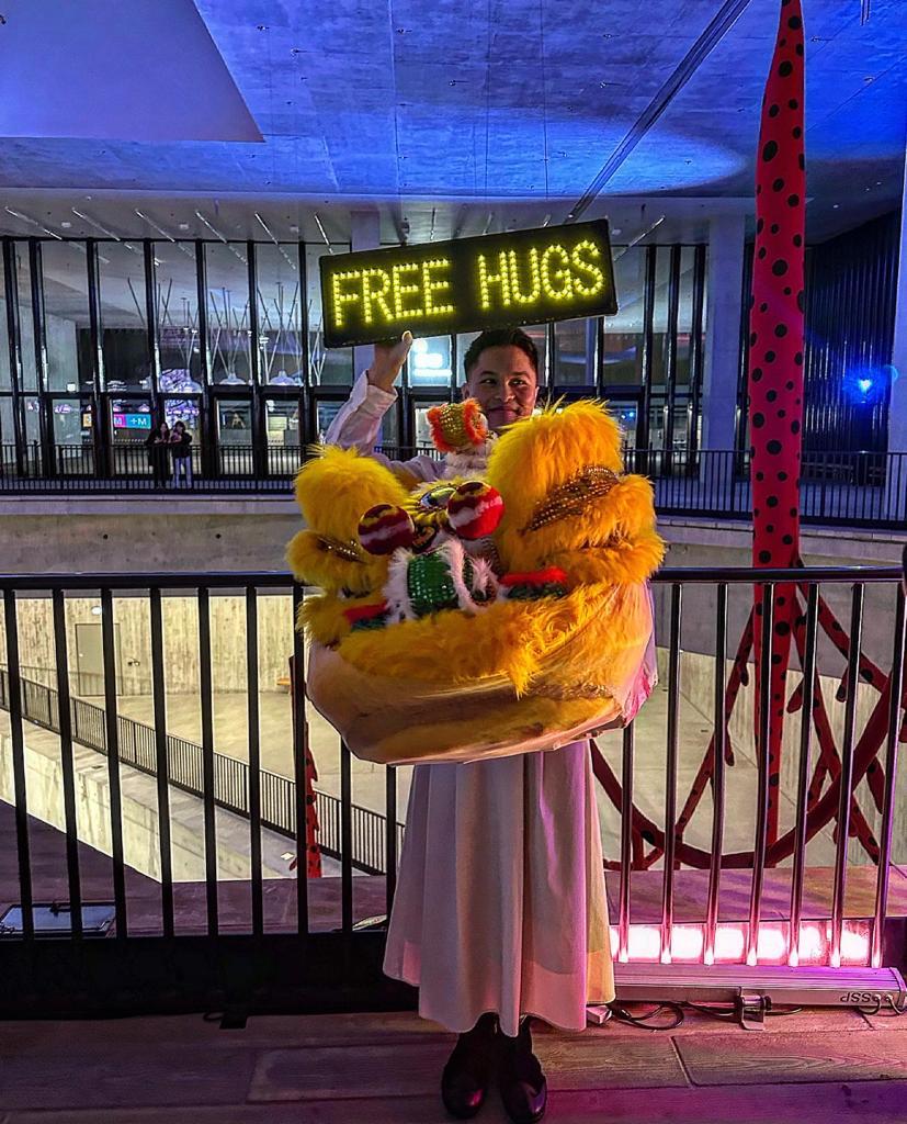 Free Hugs given by a dragon’s head were available at the official dinner given by M+ . Photograph by Simon de Pury.