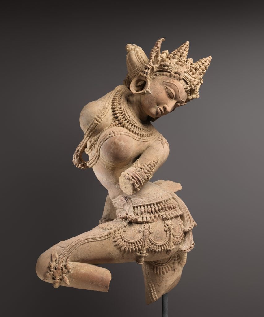 Celestial Dancer (Devata), Central India, Madhya Pradesh (11th century). Collection of the Metropolitan Museum of Art, New York. Florence and Herbert Irving donated the work to the Met, but it was purchased from Art of the Past, the New York gallery of convicted antiquities smuggler Subhash Kapoor.