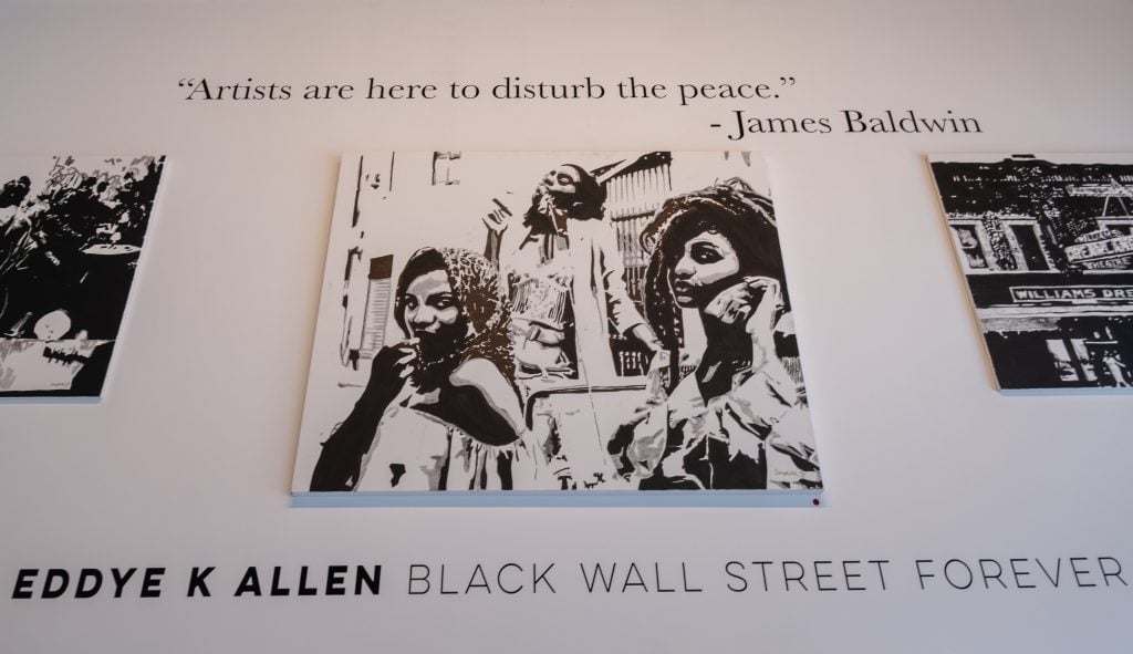A gallery featuring black artists displays art during Juneteenth celebrations in the Greenwood district of Tulsa, the site of the 1921 race massacre, on June 19, 2020. (Photo by SETH HERALD/AFP via Getty Images)