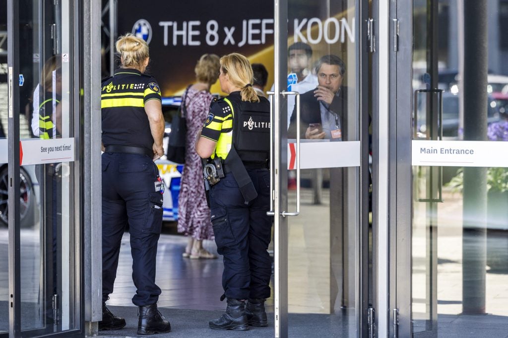 Dutch police officers stand guard at the entrance of the European Fine Art Fair in Maastricht following a jewelry heist. Armed robbers raided TEFAF on June 28, 2022, using sledgehammers to smash display cases and steal valuable jewelry. Photo by Marcel van Hoorn/ANP/AFP/Netherlands OUT via Getty Images.