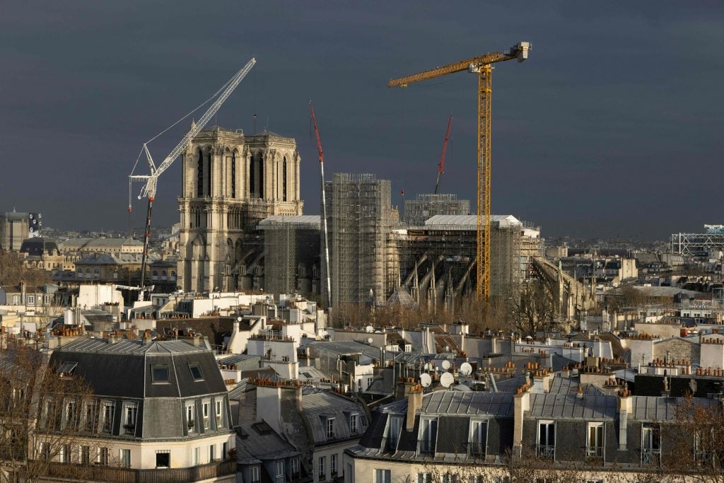 This photograph taken in Paris, on February 1, 2023 shows Notre-Dame de Paris cathedral, covered in scaffolding during reconstruction work following the 2019 fire in the church. Photo by Joel Saget/AFP via Getty Images.