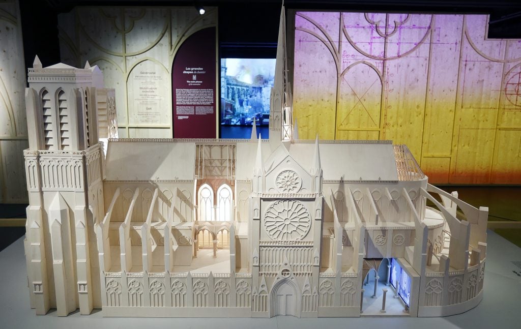 A wooden model of Notre Dame cathedral on view in "Notre Dame de Paris: at the heart of the construction site," a new underground exhibition in the forecourt of the cathedral. Photo by Thierry Chesnot/Getty Images.