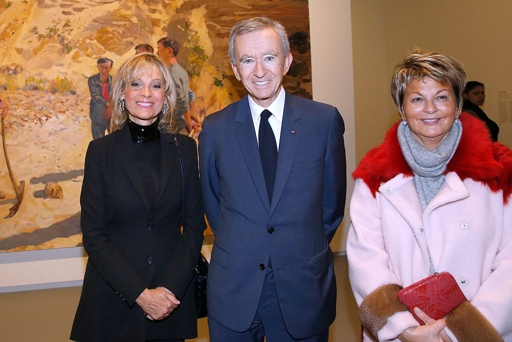 Owner of LVMH Luxury Group, collector Bernard Arnault standing with his wife Helene Arnault and Myriam Ullens while at an exhibition at the Louis Vuitton Foundation that was co-organized with the Ullens Center for in 2016. Photo by Bertrand Rindoff Petroff/Getty Images