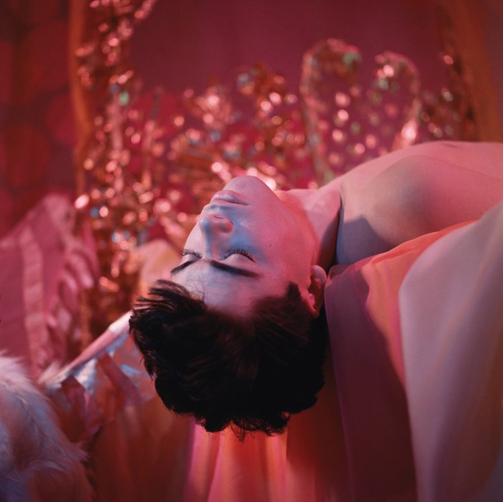Estate of James Bidgood, Hanging Off Bed (Bobby Kendall), (mid-to-late 1960s/printed later). Courtesy of CLAMP, New York.