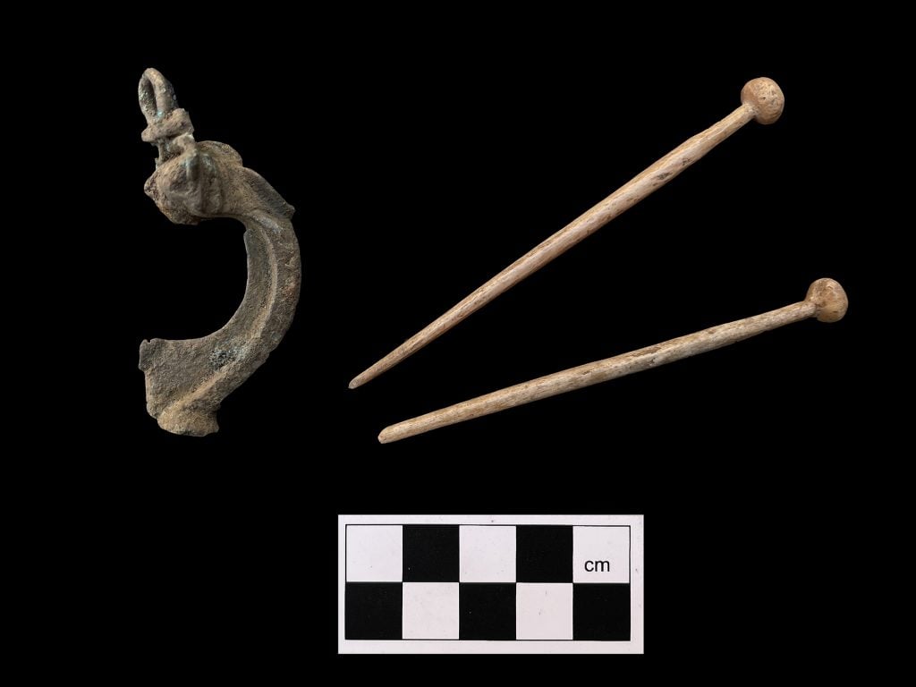 Personal adornments lost by the residents of Roman Leicester, found during the excavations (from left to right): A copper alloy head stud brooch dating to the late 1st or early 2nd century, and two hair pins crafted from animal bone around the 3rd or 4th century. Photo: ULAS