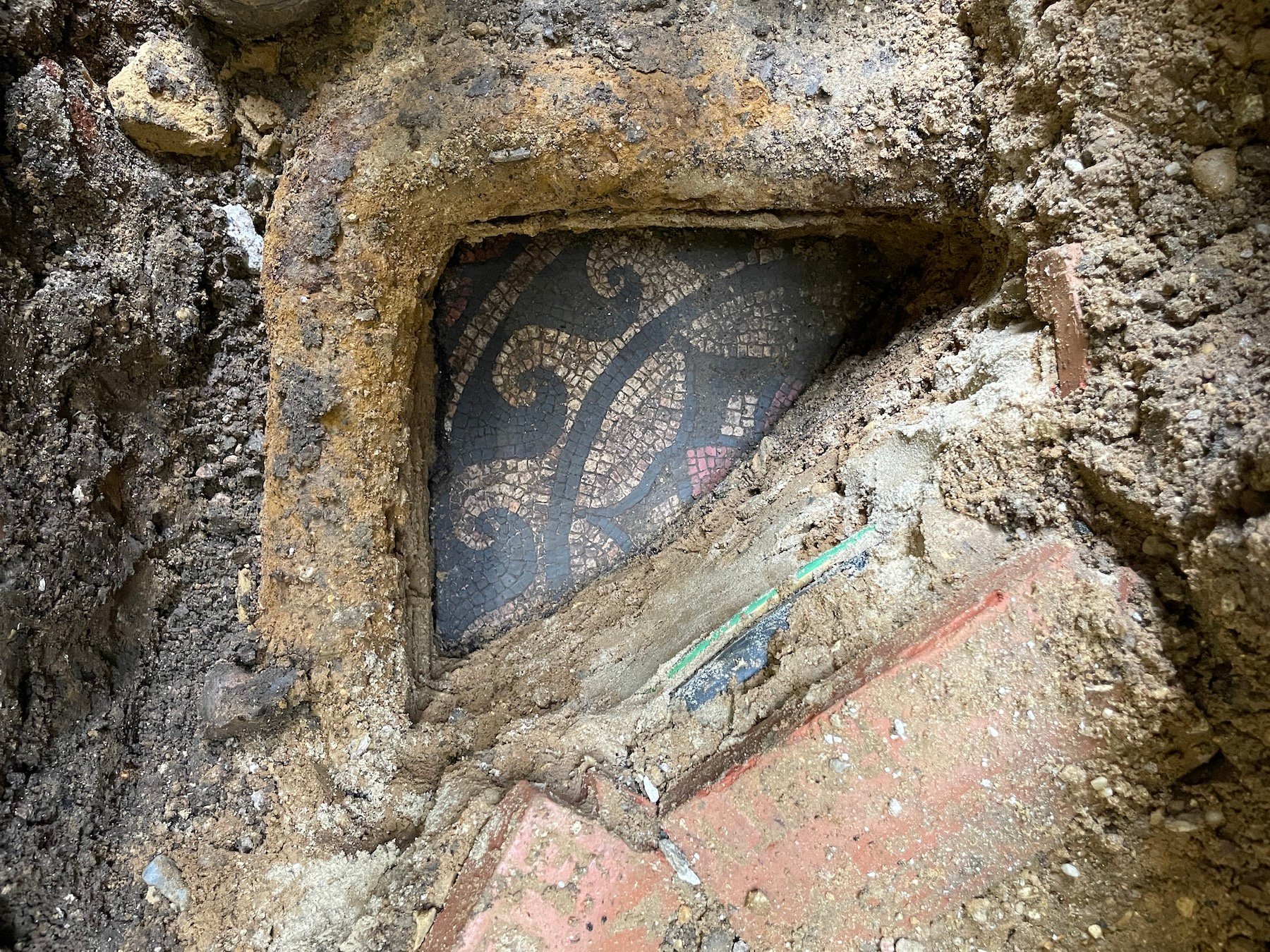 Mosaic being uncovered at Lion Walk Shopping Centre in Colchester, England. Photo: Martin Leatherdale.