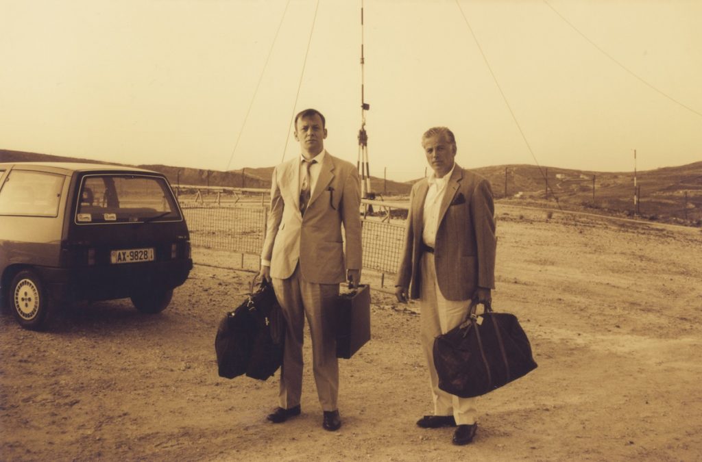 Martin Kippenberger and Michel Würthle, Syros, Greece, (1993). Photographer unknown, courtesy Estate of Martin Kippenberger, Galerie Gisela Capitain, Cologne