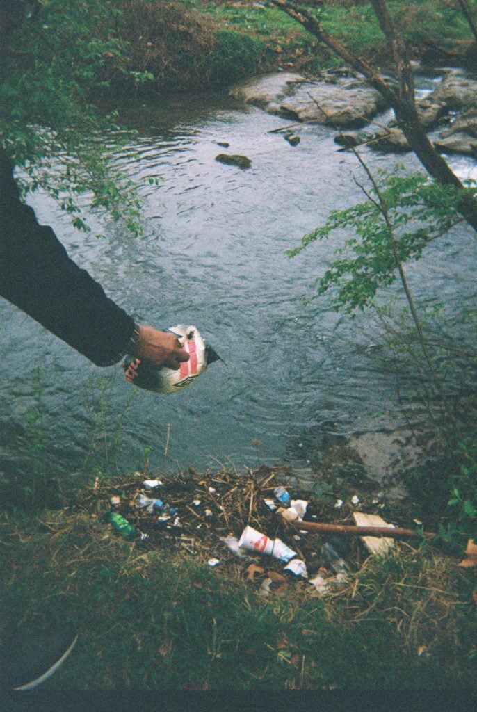 At the Big Ears Festival, where I was the artist in residence. I worked with young artists to make a music video. We went to the banks of a creek to film, and I noticed how polluted the creek was, so I started pulling materials out. Knoxville, TN.