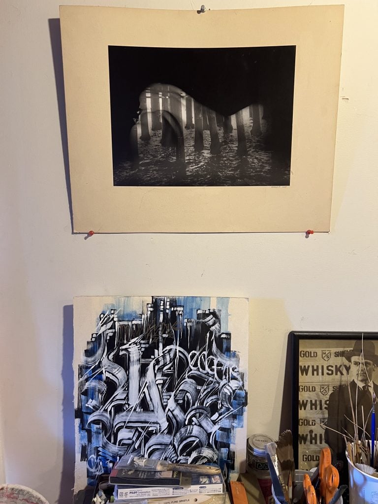 A black-and-white photograph by Angela Fujita, above a painting by the artist's friend. Photo by Angela Fujita, courtesy of the artist and L.A. Louver.