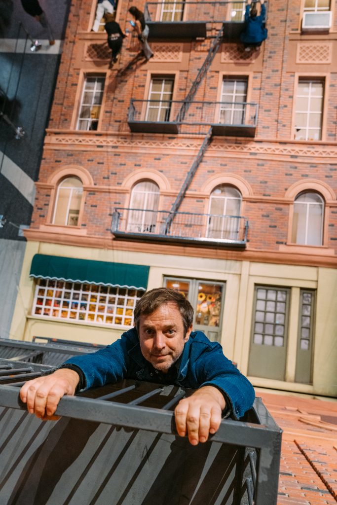 Leandro Erlich with The Building at Liberty Science Center, Jersey City. Photo by BFA.