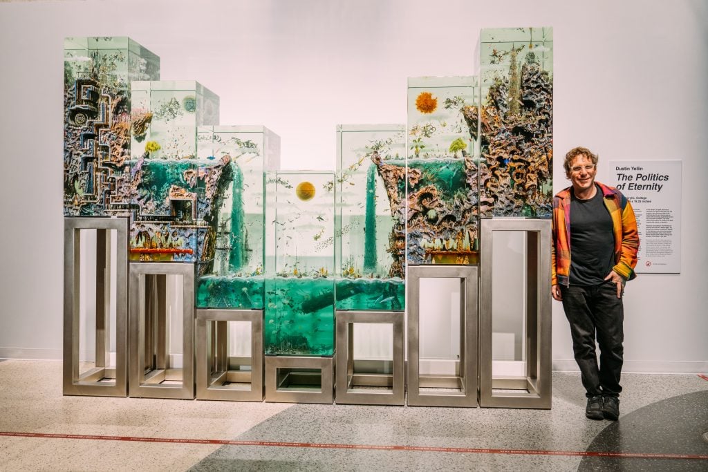 Dustin Yellin with his piece The Politics of Eternity at Liberty Science Center, Jersey City. Photo by BFA.