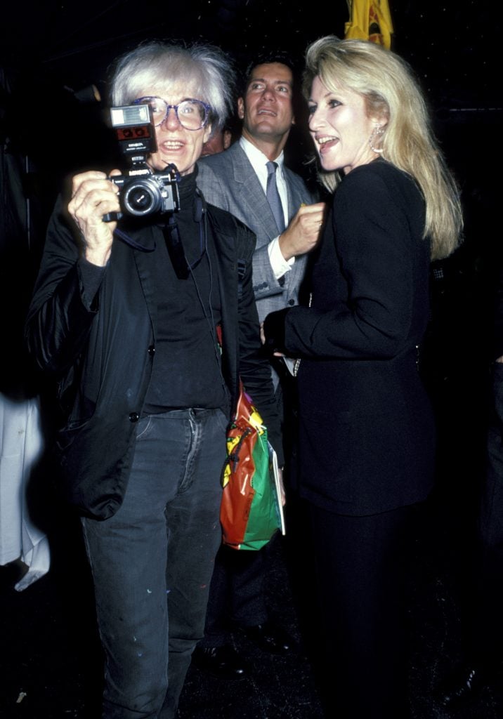 Andy Warhol and Baby Jane Holzer. Photo by Ron Galella/Ron Galella Collection via Getty Images.