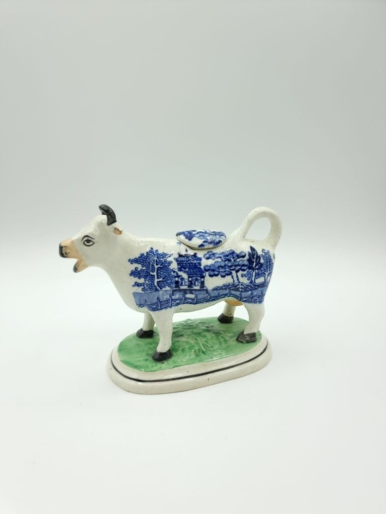 Cow-shaped cream jug. White with blue willow-pattern transfer. Courtesy of The Potteries Museum & Art Gallery, Stoke-on-Trent.