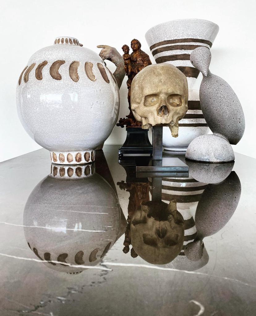 A still life of pottery by Jean Besnard and Clementine Keith-Roach, Memento Mori skull and Madonna and Child, courtesy of Simon de Pury.