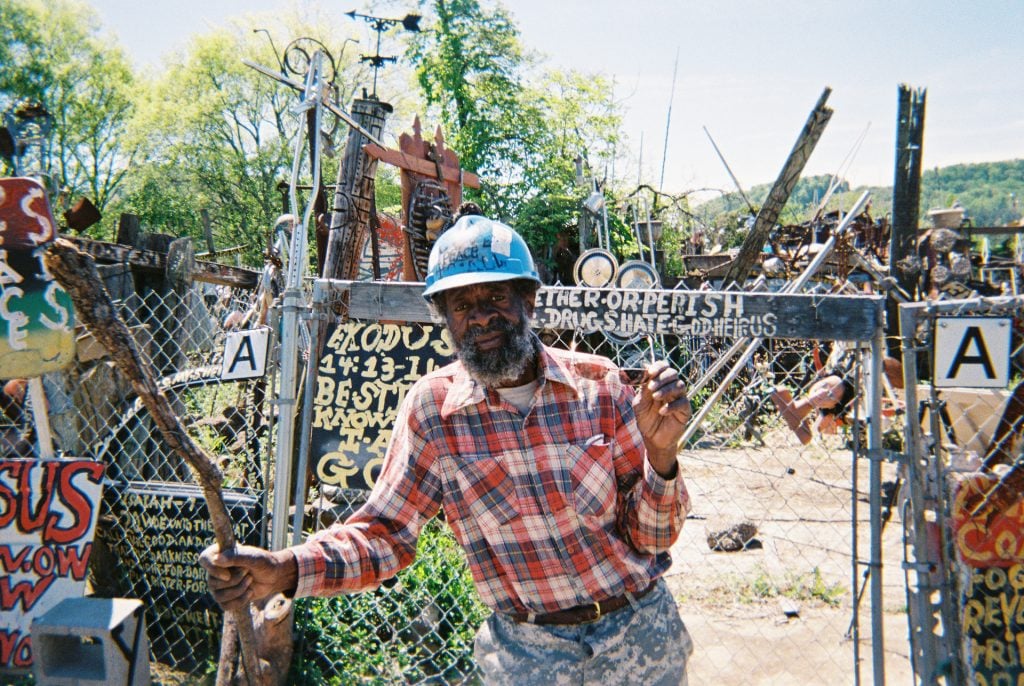 Joe Minter in front of part of his “African Village in America.” Birmingham, Alabama.