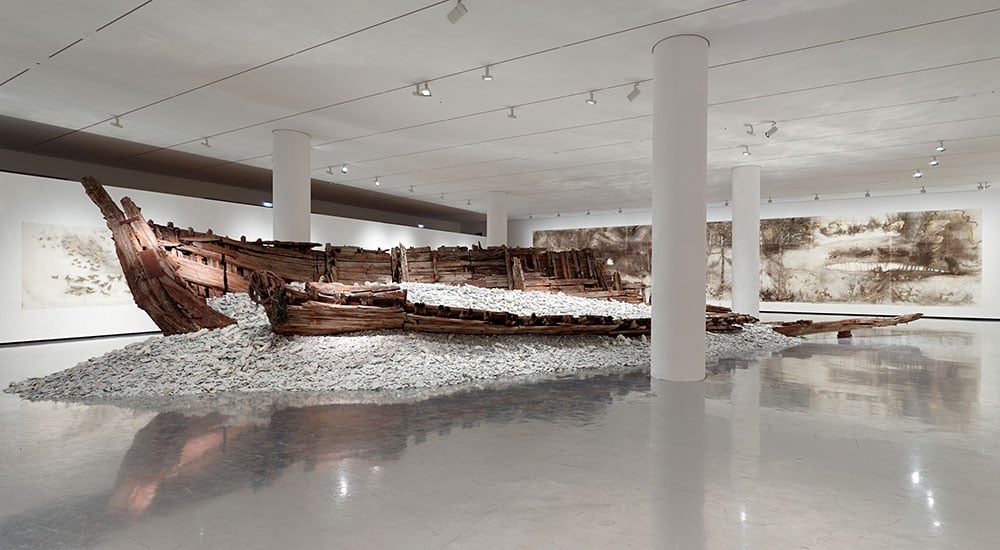 Excavated wooden boat and porcelain. Courtesy of Jens Faurschou.