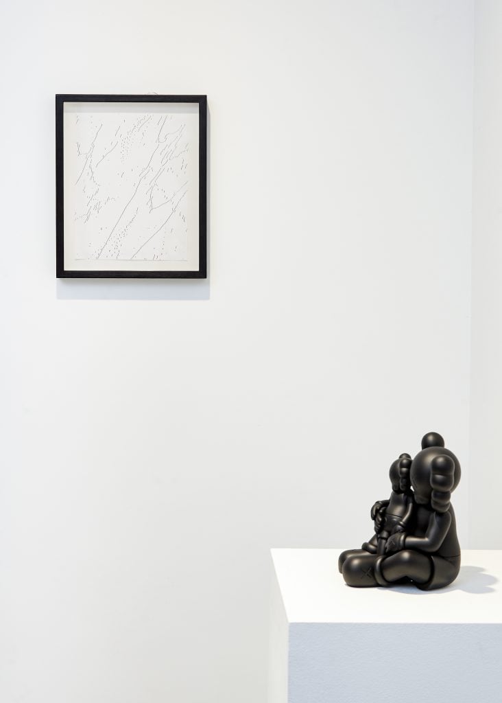 Installation view of work by Andy Warhol and Kaws. Courtesy of Baldwin Contemporary, London.