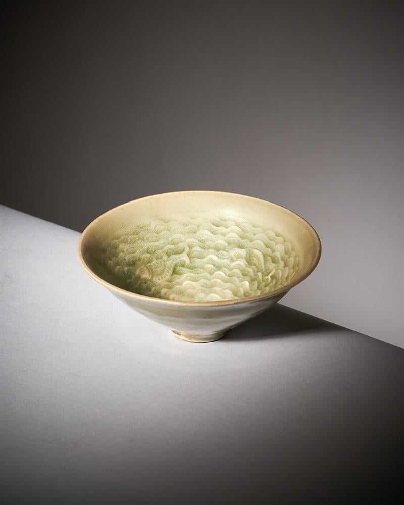A rare small Chinese 'Yaozhou' celadon 'fish' conical bowl from the collection of Edward Copleston Radcliffe sold for £24,000 ($29,900) at Dreweatts. Photo courtesy of Dreweatts. 