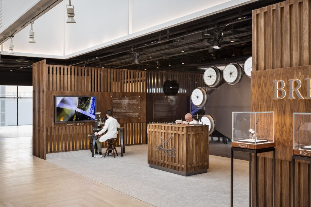 A watchmaker and guillocheur ply their trades at Frieze New York. Courtesy of Breguet. 