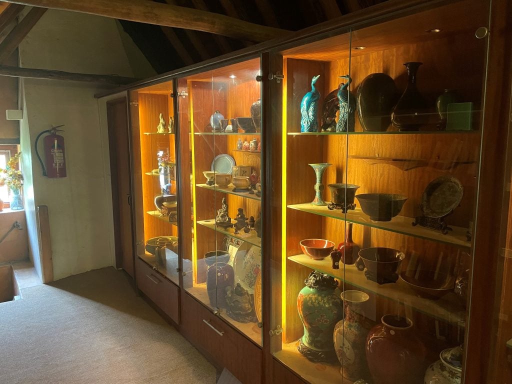 Edward Copleston Radcliffe's collection of Chinese antiquities, seen here in a dusty attic cabinet, resulted in a white glove sale at Dreweatts. Photo courtesy of Dreweatts.