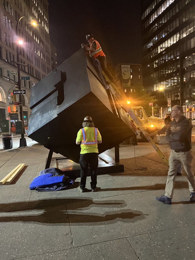 Bernard "Tony" Rosenthal, <em>Alamo</em> (1967). The artwork known as the Astor Place Cube being removed for restoration. Photo courtesy of the New York City Department of Transportation. 