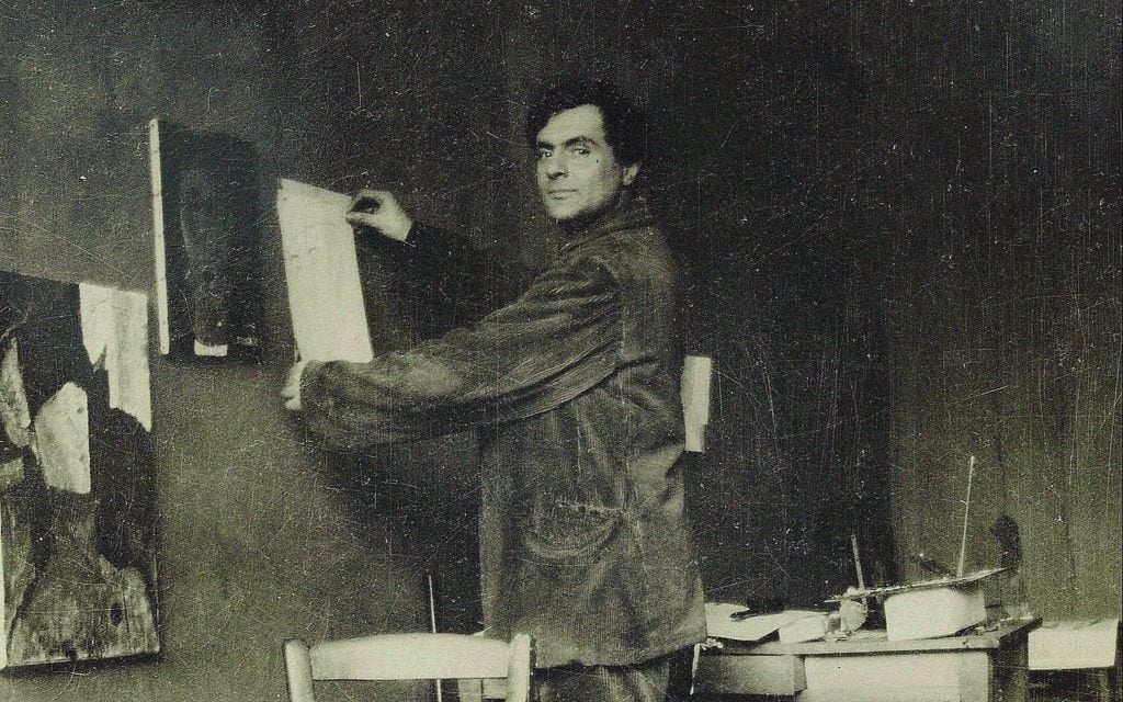 Amedeo Modigliani in his studio, 1910s. Private Collection. Photo by Fine Art Images/Heritage Images/Getty Images.