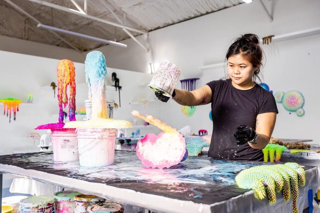 Meow Wolf collaborative artist Dan Lam in the studio. Photo by Jordan Mathis, courtesy of Meow Wolf.