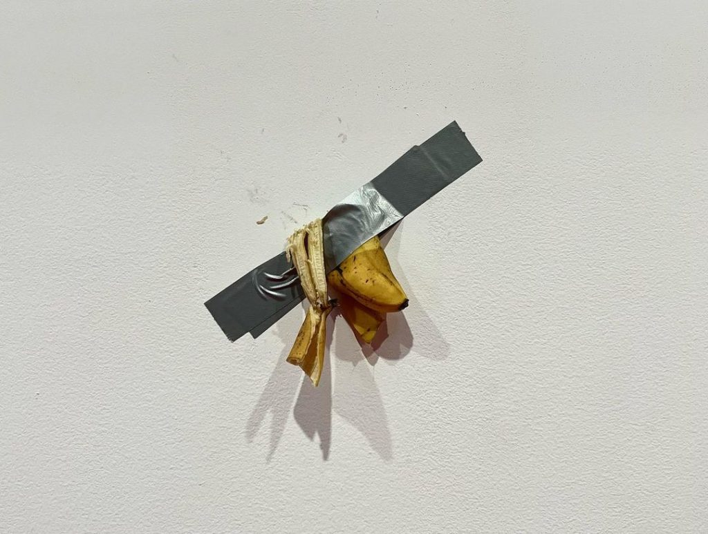 Maurizio Cattelan's <em>Comedian</em> after being eaten by Noh Huyn-soo and taped back on the wall at the Leeum Museum of Art in Seoul. Photo courtesy of Noh Huyn-soo. 