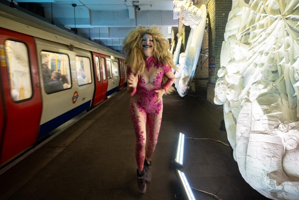 Monster Chetwynd with her exhibition "Pond Life: Albertopolis and the Lily" (2023). Gloucester Road Station. Commissioned by Art on the Underground. Photo by Benedict Johnson.