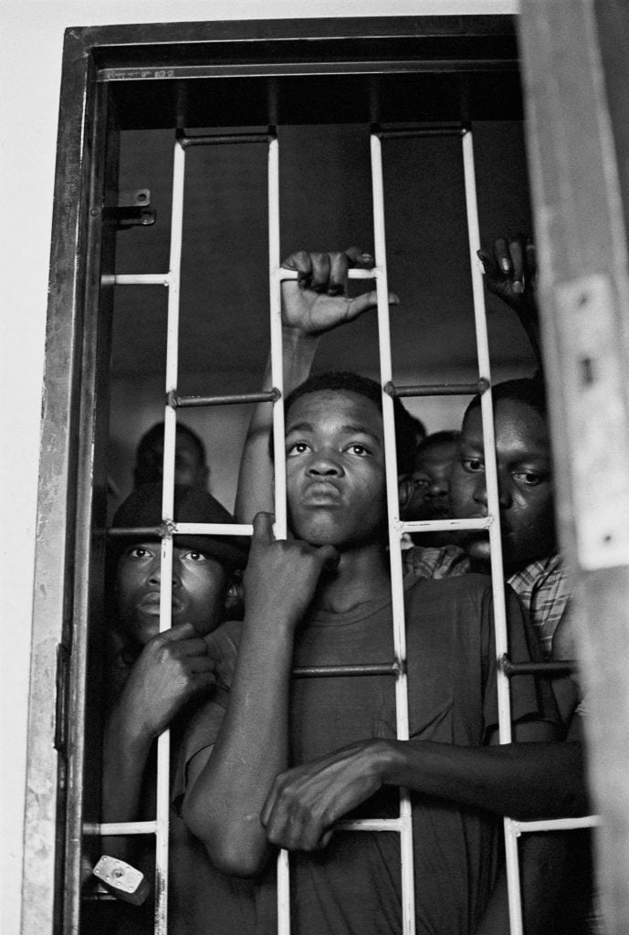 Ernest Cole, from <em>House of Bondage</em>. These boys were caught trespassing in a white area. Photo ©Ernest Cole, courtesy of Magnum Photos.