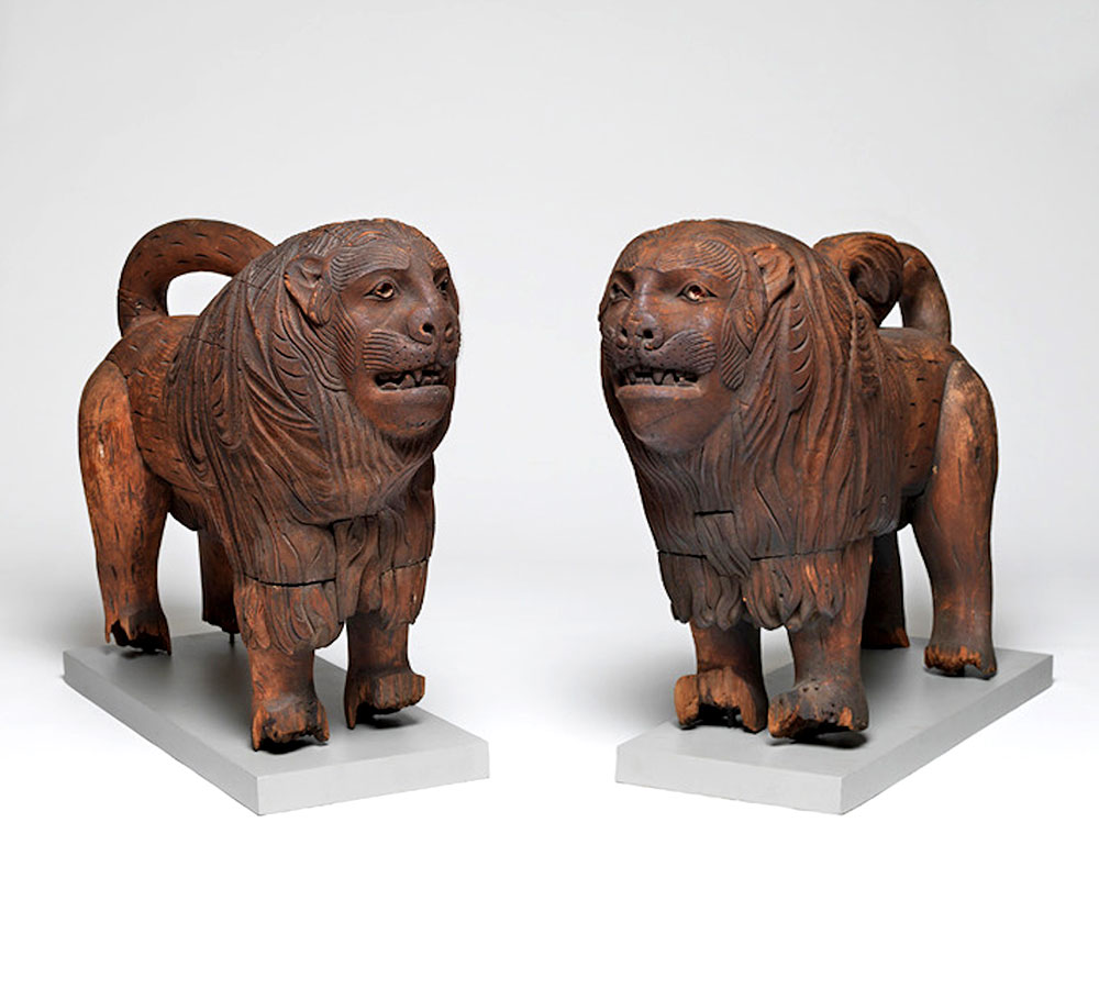 Anonymous Haida artist, <em>Pair of Lions</em> (ca. 1840). Red spruce or cedar, iron nails. Courtesy of Donald Ellis Gallery.