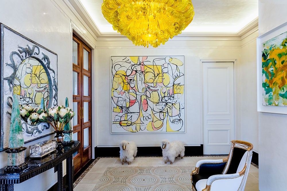 The George Condo (center) in the entrance of the Plaza Hotel pied-à-terre. Courtesy of Lisa Fayne Cohen.