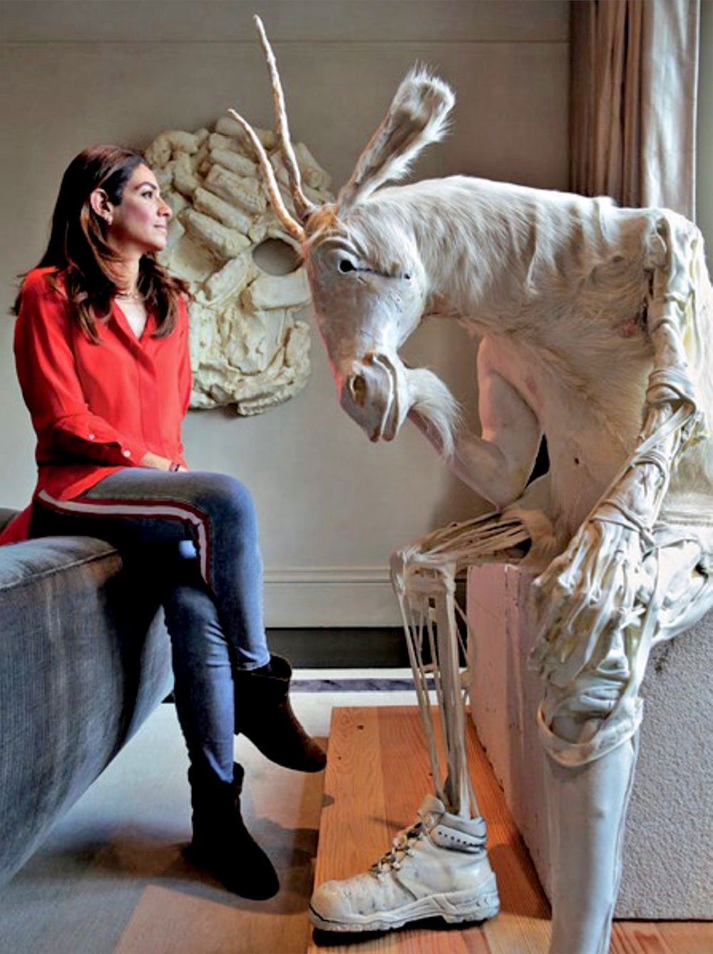 Maria Sukkar with Pawel Althamer's Self Portrait as Billy the Goat and Thomas Houseago's Earth Mask II. Courtesy of Maria Sukkar.