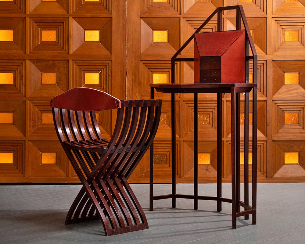 Pierre Paulin, <em>Bonheur-du-jour</em> desk and <em>Curule</em> chair (1983). Mahogany and leather. Presented by R & Company.