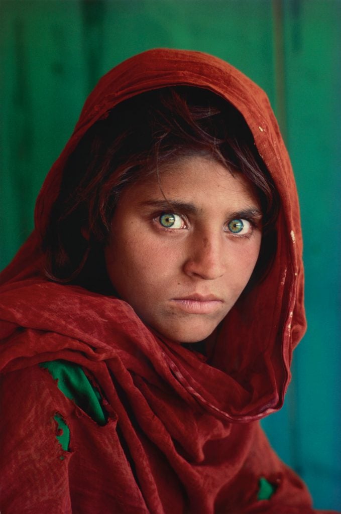 Steve McCurry, Sharbat Gula, Afghan Girl, Pakistan (1984). Est. $12,000–$18,000.
